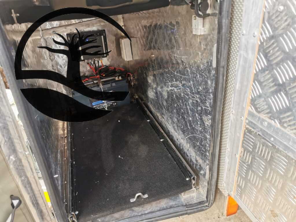 Custom fridge slide and nosecone door caddie installed during Remodeling of a B'rakah Camping trailer.