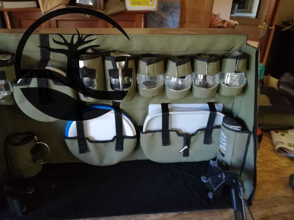 Custom Canvas Caddie to hold Melamine plates and bowls, paper plates and holder, Stainless steel mugs and glasses fitted to an aluminum Bakkie canopy.