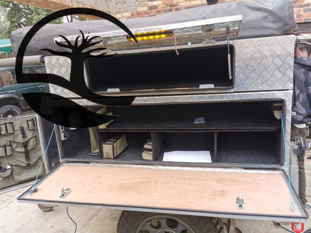 Installation of Custom aluminum Kitchen boxes and custom canvas pockets, bags and caddies during Remodeling of a B'rakah Camping trailer.