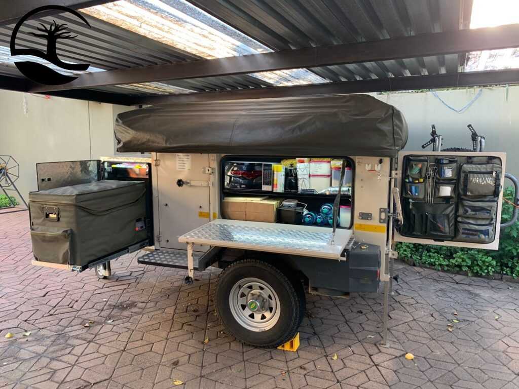 Custom Canvas Fridge Cover and back door caddie in a Echo 5 Camping trailer,